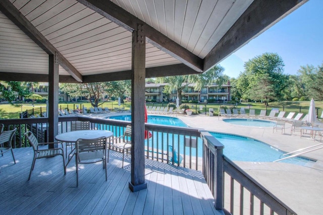 view of swimming pool with a hot tub and a patio area