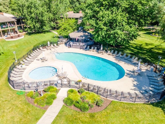 view of pool featuring a yard and a patio area