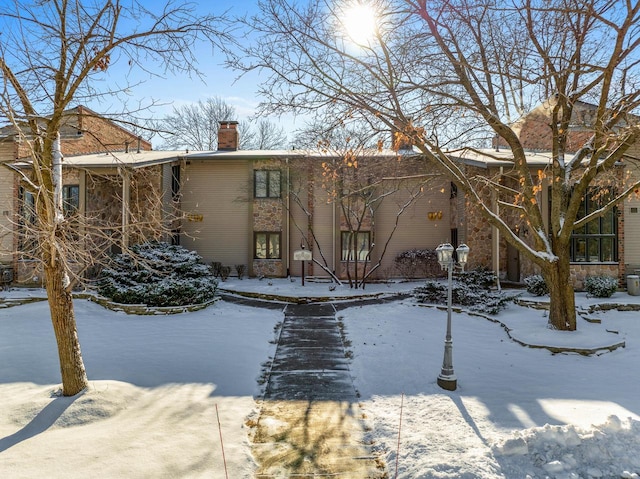 view of snow covered house