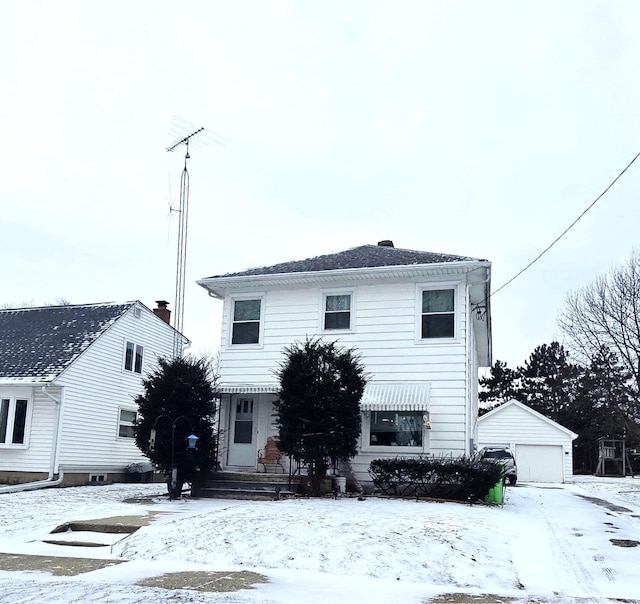 view of front property with a garage and an outdoor structure