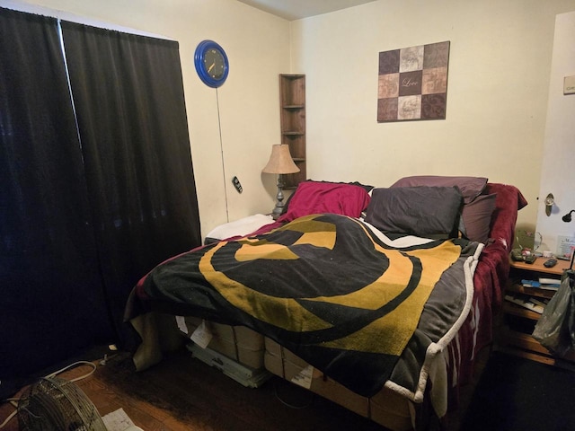 bedroom featuring dark hardwood / wood-style floors