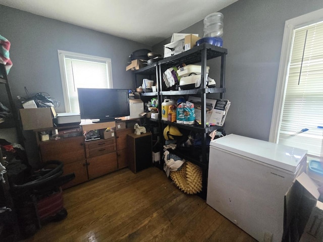 laundry area with dark hardwood / wood-style floors