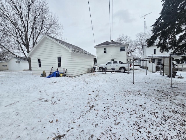 view of snow covered house