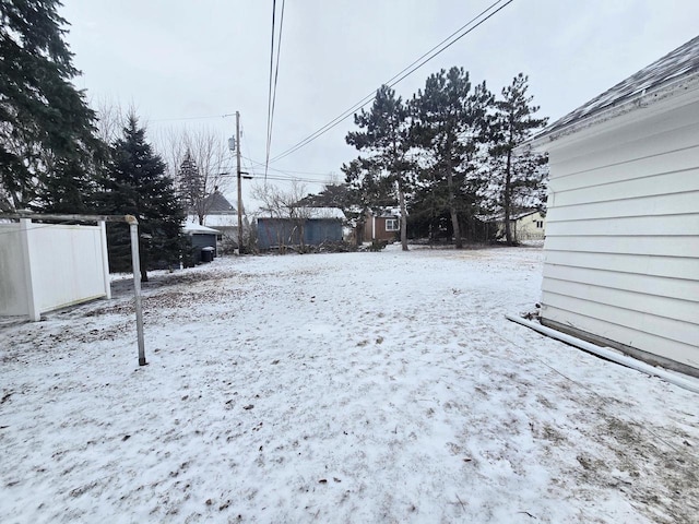 view of yard covered in snow