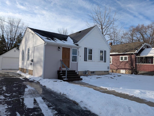 view of front of home featuring an outbuilding and a garage