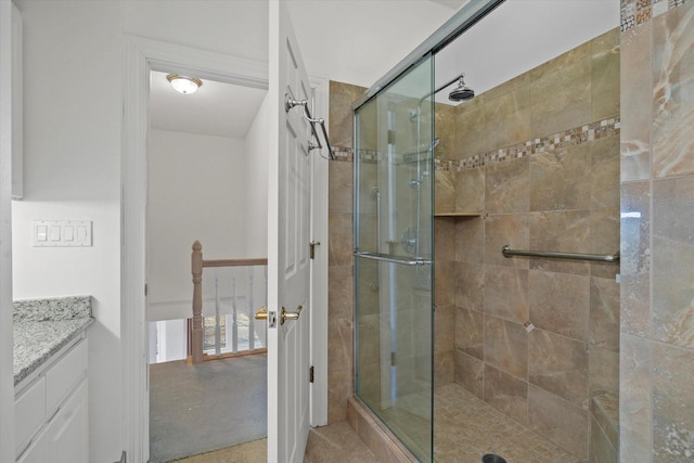 bathroom featuring an enclosed shower and vanity