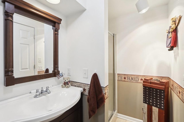 bathroom featuring vanity and a shower with shower door