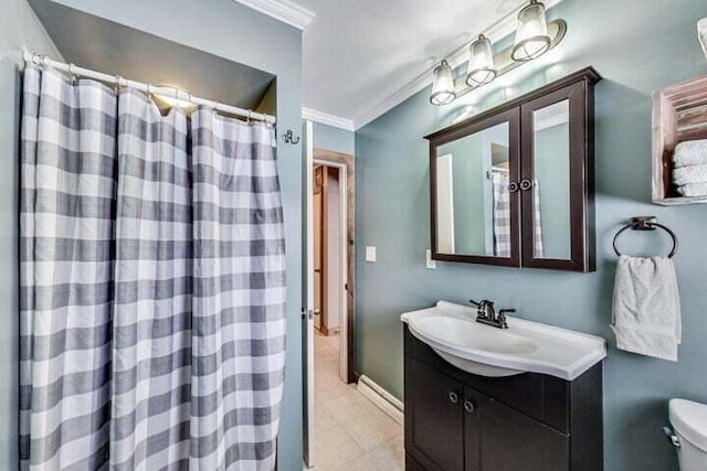 bathroom with vanity, crown molding, and toilet