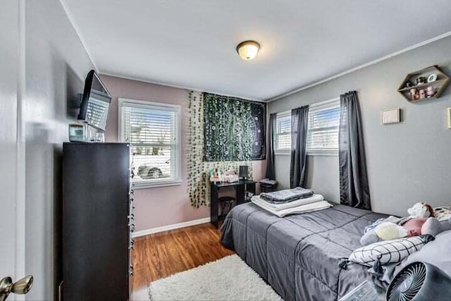 bedroom with dark wood-type flooring