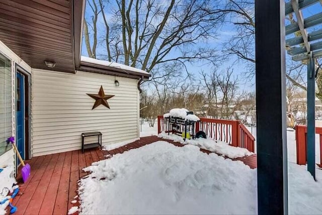 view of snow covered deck