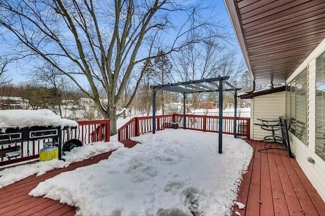 snow covered deck with a pergola