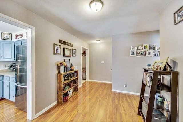 hallway with light hardwood / wood-style floors