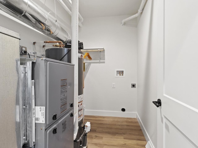 laundry area featuring washer hookup, wood-type flooring, and electric dryer hookup