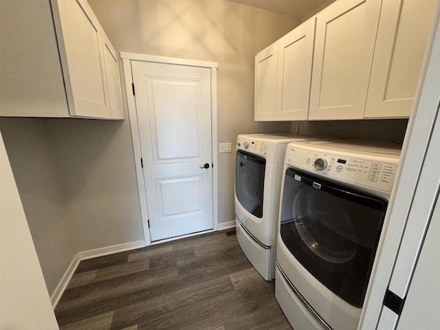 clothes washing area featuring cabinets, independent washer and dryer, and dark hardwood / wood-style floors