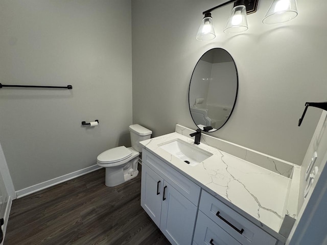 bathroom featuring vanity, toilet, and wood-type flooring