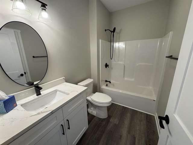 full bathroom with hardwood / wood-style flooring, shower / bathtub combination, vanity, and toilet