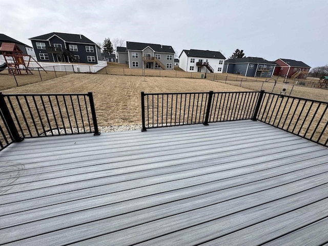 wooden terrace featuring a playground