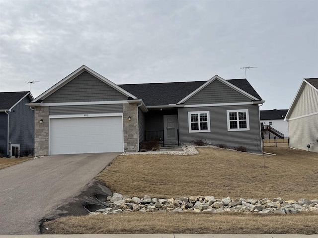 ranch-style home featuring a garage