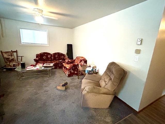 carpeted living room with ceiling fan