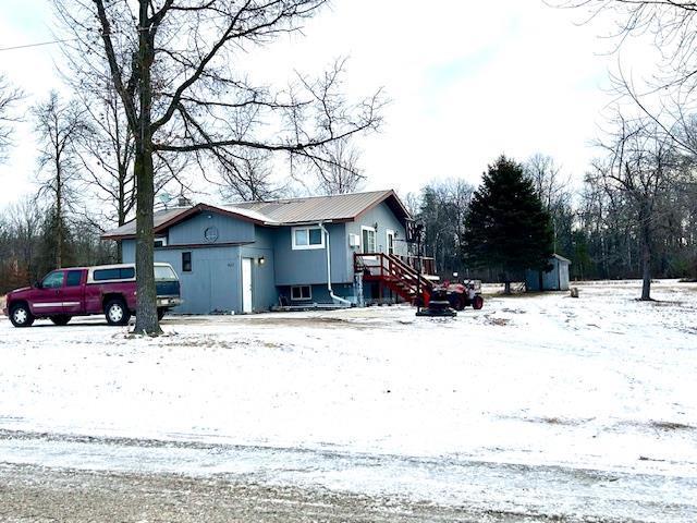 view of snow covered property