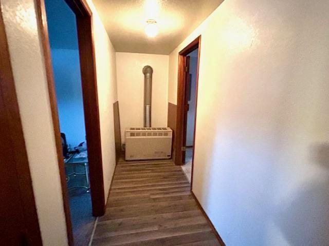 hallway featuring dark hardwood / wood-style flooring