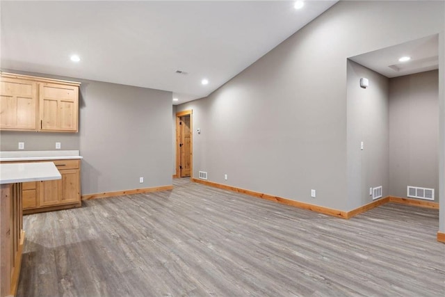 kitchen featuring light hardwood / wood-style flooring and light brown cabinets