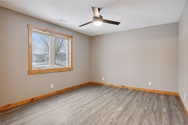 spare room with ceiling fan and light hardwood / wood-style flooring