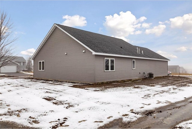 view of snow covered exterior with central air condition unit