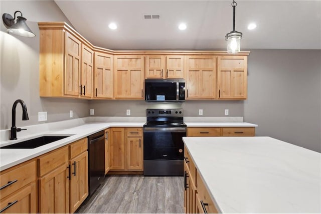 kitchen featuring sink, appliances with stainless steel finishes, dark hardwood / wood-style flooring, decorative light fixtures, and light brown cabinets