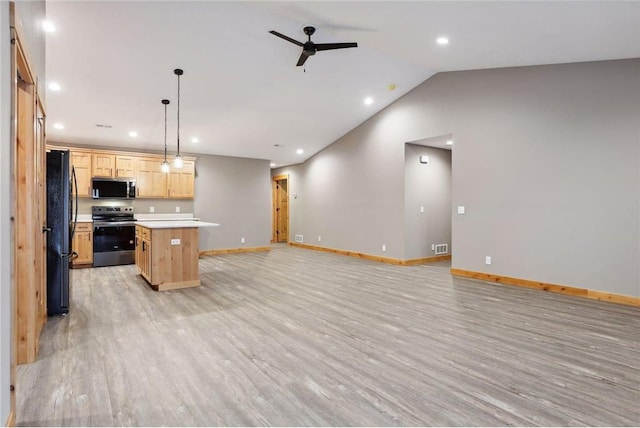 kitchen with a center island, light brown cabinets, appliances with stainless steel finishes, pendant lighting, and light hardwood / wood-style floors