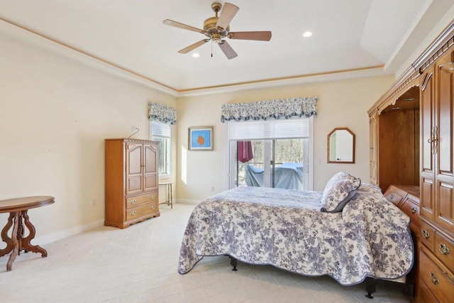 bedroom featuring recessed lighting, light carpet, access to exterior, baseboards, and a tray ceiling