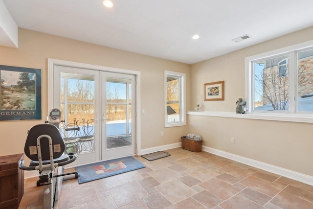 workout area featuring stone finish floor, visible vents, baseboards, and recessed lighting