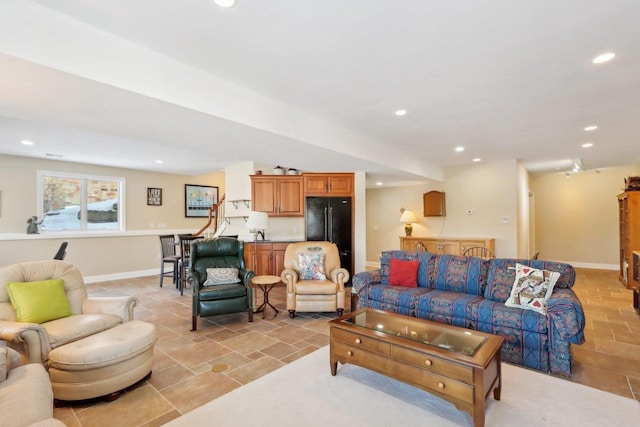 living room with recessed lighting and baseboards