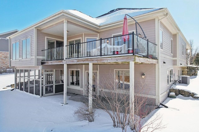 view of front facade featuring cooling unit and a balcony