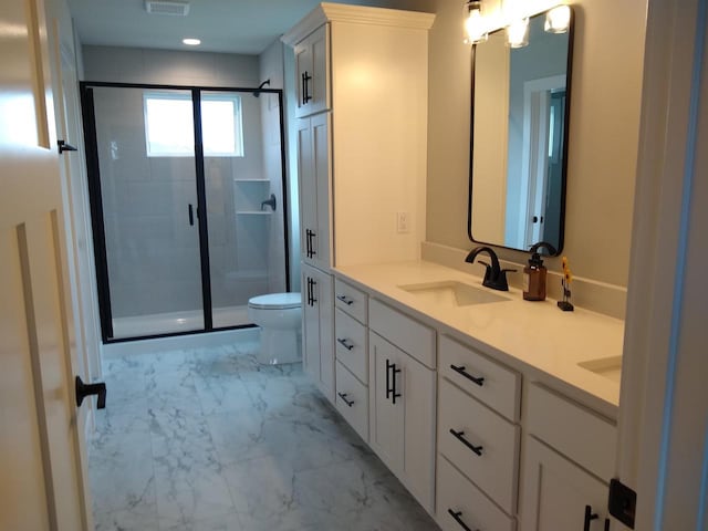 bathroom with toilet, a sink, marble finish floor, double vanity, and a stall shower