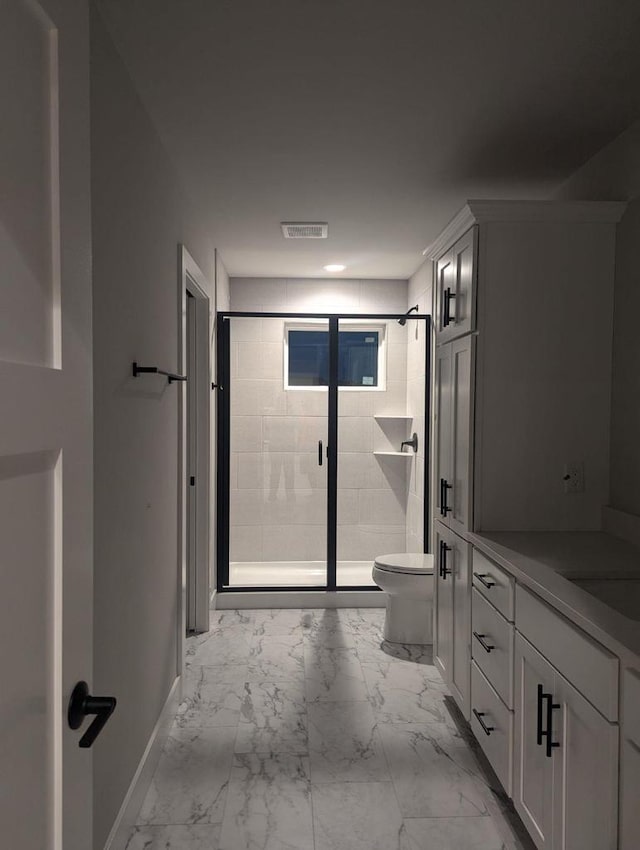 bathroom with marble finish floor, visible vents, a shower stall, and toilet