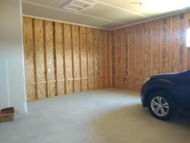 empty room with concrete flooring and visible vents