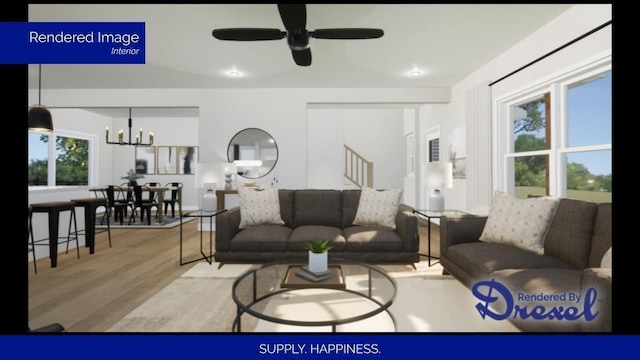 living area featuring ceiling fan with notable chandelier, plenty of natural light, and wood finished floors