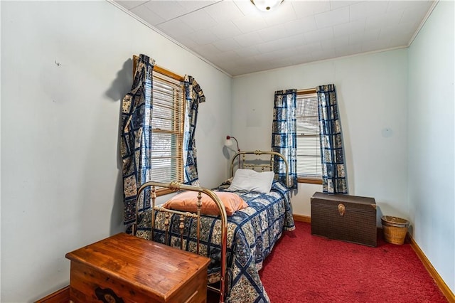 bedroom featuring crown molding and carpet floors