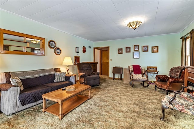 carpeted living room with ornamental molding