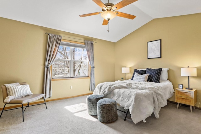 carpeted bedroom featuring ceiling fan, baseboards, and lofted ceiling