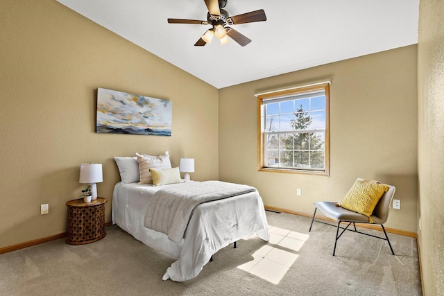 bedroom with baseboards, lofted ceiling, and carpet