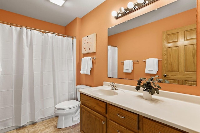 bathroom with toilet and vanity