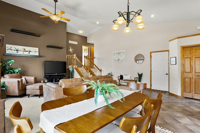 dining area featuring baseboards, stairway, recessed lighting, ceiling fan with notable chandelier, and high vaulted ceiling