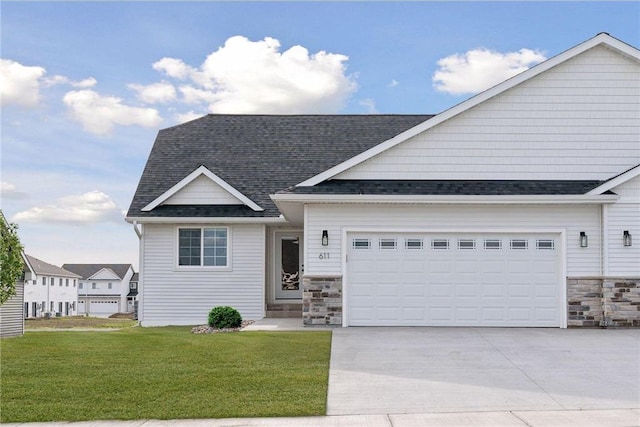 603 S Division St, Roberts, WI 54023 - view of front of home featuring a garage and a front yard