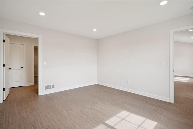 unfurnished room featuring hardwood / wood-style floors