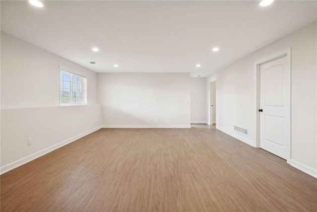 empty room featuring wood-type flooring