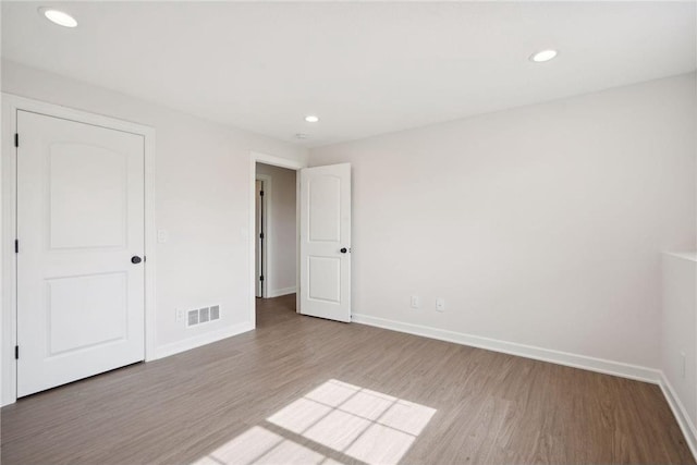 unfurnished bedroom featuring hardwood / wood-style floors