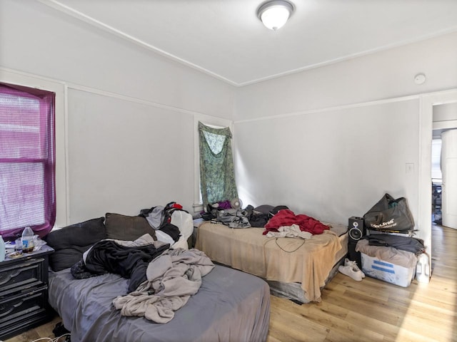 bedroom with wood-type flooring