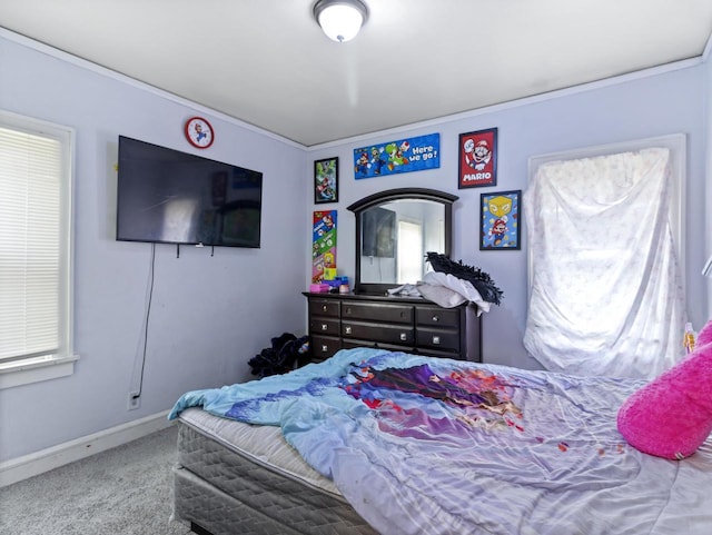 bedroom with crown molding and carpet